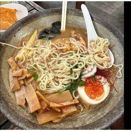 A bowl of karaage chicken ramen from Rice Boi Mooloolaba with soft egg, bamboo shoots, noodles and rich broth A bowl of karaage chicken ramen from Rice Boi Mooloolaba with soft egg, bamboo shoots, noodles and rich broth
