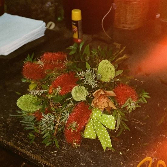 A 'Bold and Beautiful' native flower arrangement for Bathurst, showcasing the vibrant pop of red Bottlebrush flowers that make a memorable bouquet.