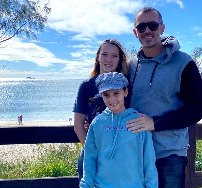 Andrew with Ivy and Asha at Byron Bay in 2022