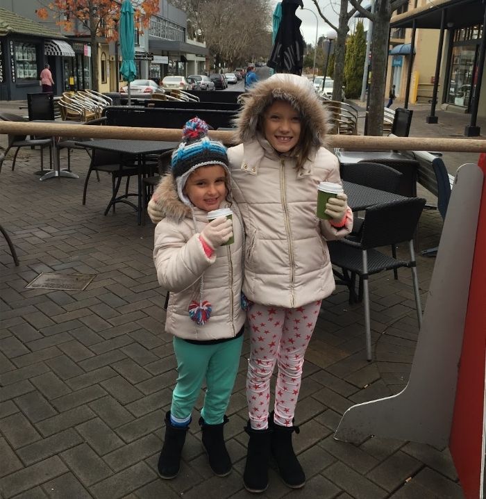 Asha and Ivy drinking hot chocolate in Bowral NSW, July 2015