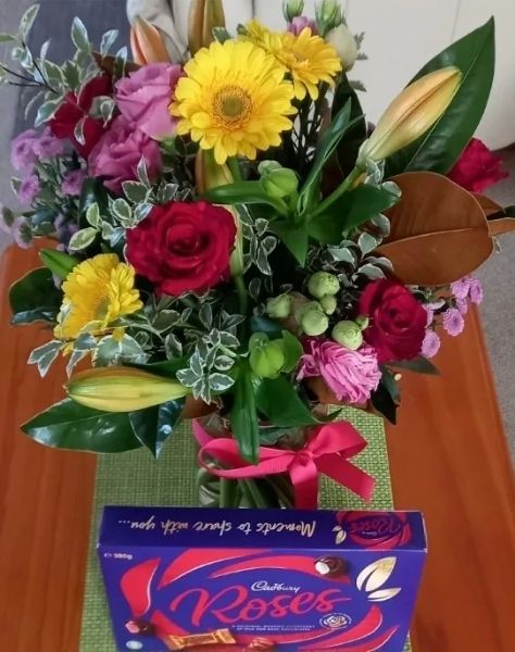 Bright Bunch with Vase and Cadbury Roses chocolates, delivered to Sebastopol for an 80th birthday