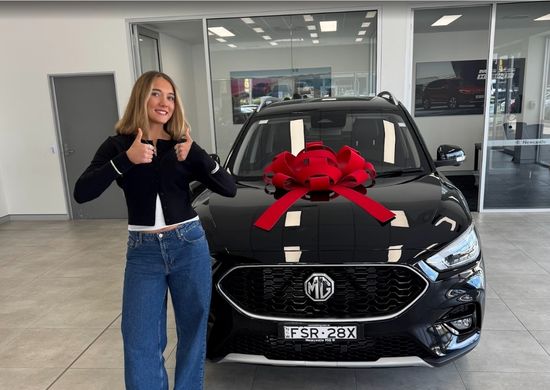 Asha Thomson picking up her new car at Newcastle MG, September 2025