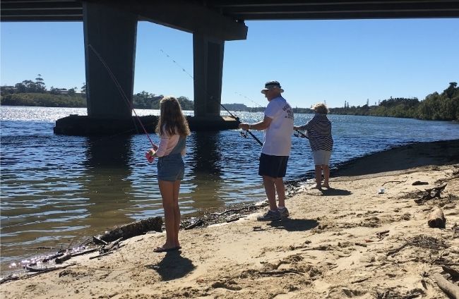 Ken, Judy and Asha fishing under the Chinderah bridge on the Tweed River