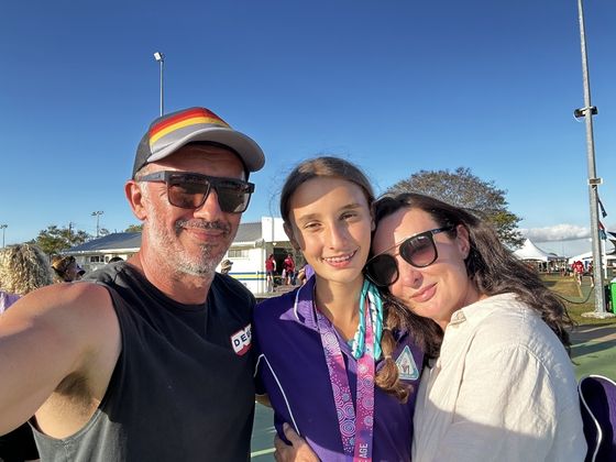 Andrew, Siobhan and Ivy Thomson at netball state titles in Annandale, Townsville 2023