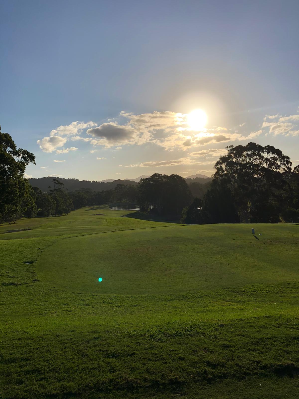Sunset from the 18th hole at Ocean Shores Country Club looking back toward the clubhouse and the 1st fairway, taken by Andrew Thomson on one of his monthly golf trips