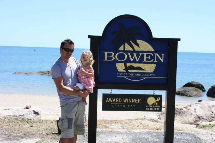 Siobhan, Andrew and daughter Asha on their family trip to Bowen Queensland in 2009, standing near Grays Bay with the Coral Sea behind them