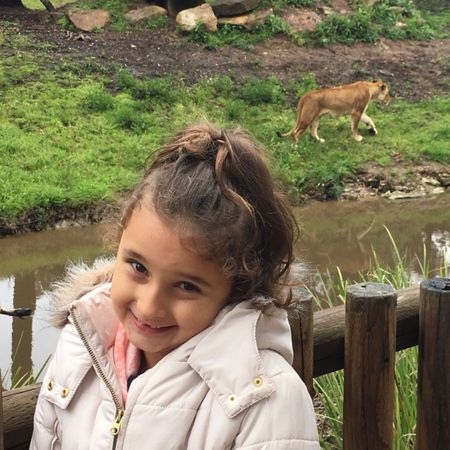 Ivy Thomson aged five at Taronga Western Plains Zoo in Dubbo, September 2016, standing by the lion enclosure in a white puffer jacket with a big grin Ivy Thomson aged five at Taronga Western Plains Zoo in Dubbo, September 2016, standing by the lion enclosure in a white puffer jacket with a big grin